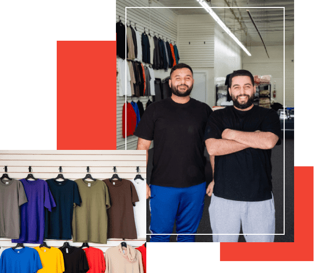 Two men standing in front of a clothing rack.